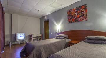 Двухместный номер с 2 отдельными кроватями и балконом в Гостинице Южная Трибуна